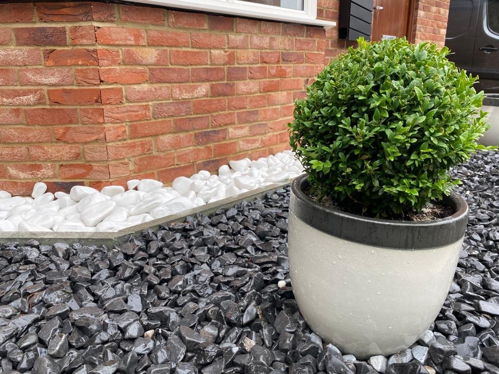 Natural garden stone being sealed and impregnated for weather protection in the UK