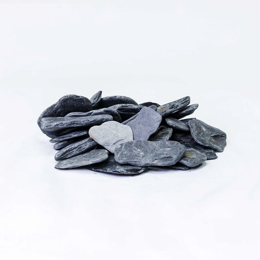 Black tumbled slate gravel 30-50mm decorative garden stones in UK landscaping project – ideal for driveways, borders, and rock gardens.