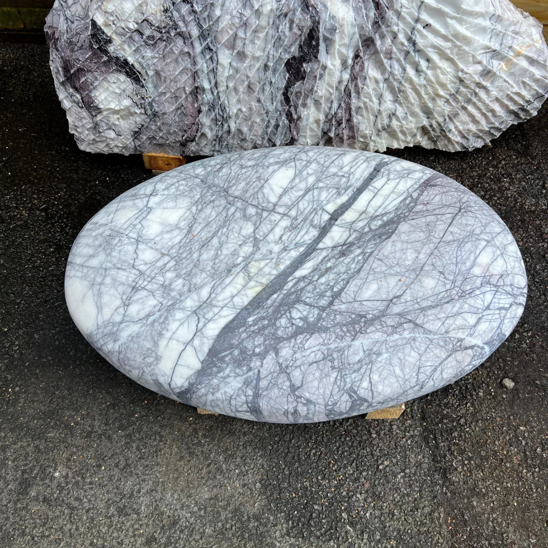 Round marble monolith with polished grey and white tones, ideal as a decorative garden stone or landscape feature.