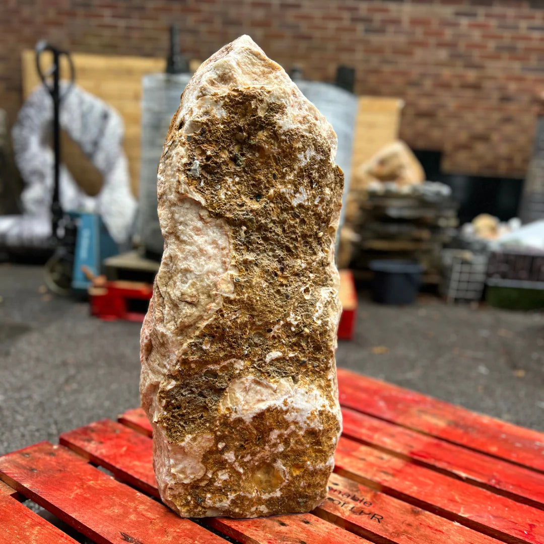 Monolith MON-027 natural garden stone featuring warm brown and white tones, ideal for decorative landscaping.