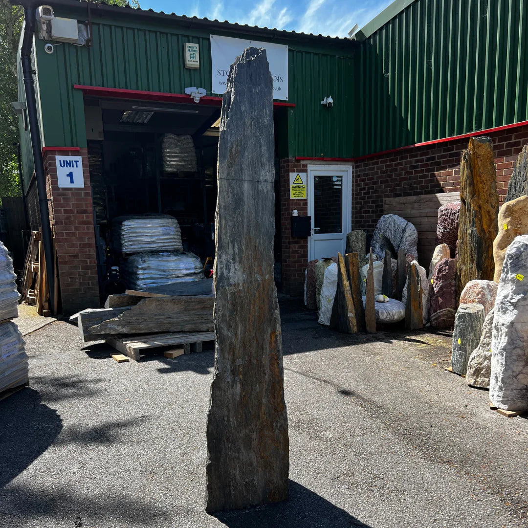 Handpicked golden-hued monolith designed for modern gardens, offering a unique natural stone centerpiece.