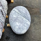 Natural marble pillow monolith from Italy, blending refined craftsmanship and natural beauty for UK garden spaces.