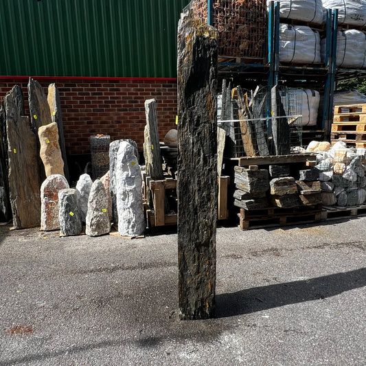 UK garden stone monolith unique piece ideal for modern landscaping, surrounded by decorative gravel and rocks.
