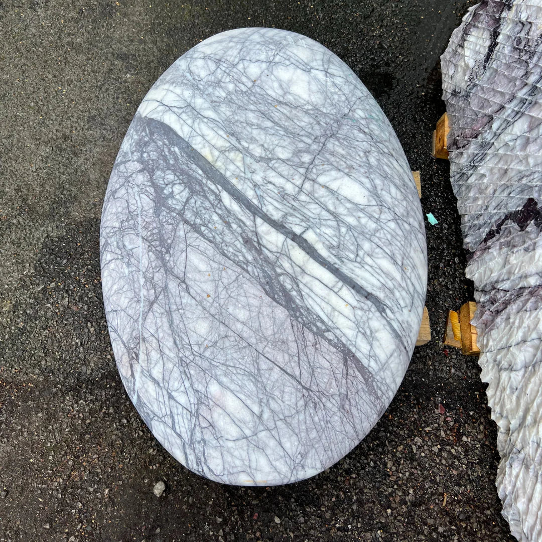 Polished marble monolith showcased by Stones4Gardens, perfect for pairing with garden pebbles or gravel areas.