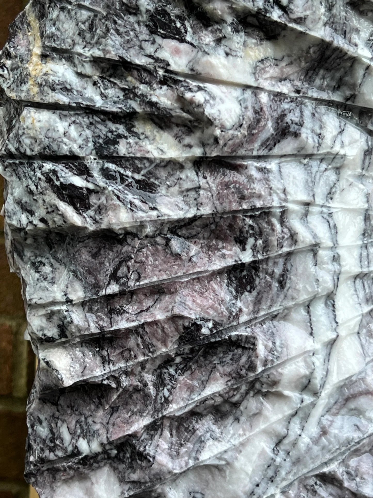 Premium garden stone feature made from Leylak marble, a handcrafted Italian monolith designed for elegant outdoor environments.