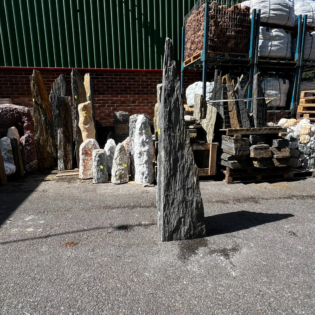 Tall dark natural stone monolith MON-062, handcrafted for UK gardens and outdoor landscaping displays.