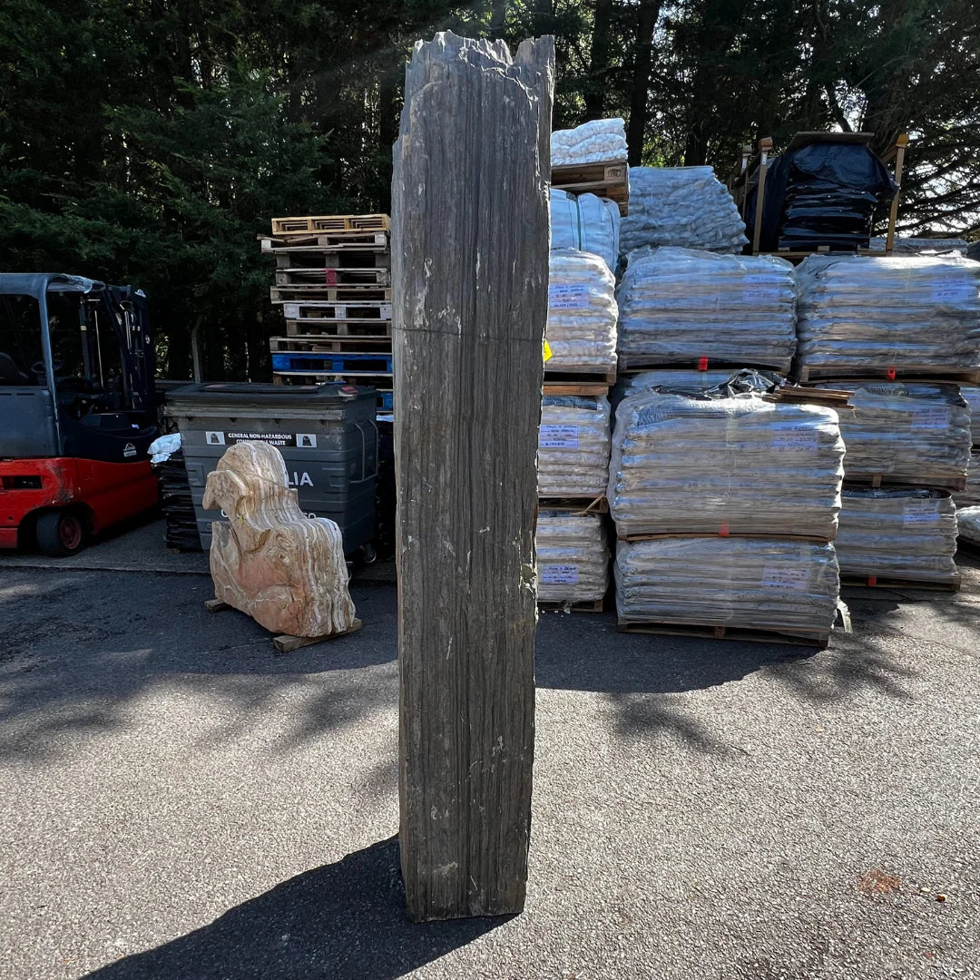 Tall natural stone monolith MON-060 with gold and grey surface tones, a standout garden feature for UK landscapes.