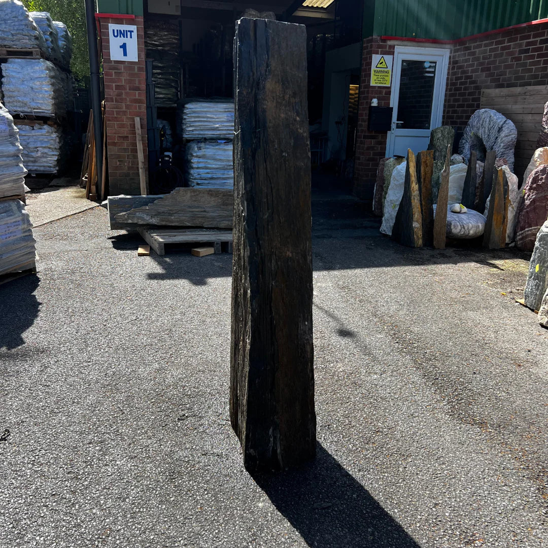 Tall natural stone monolith MON-061 with rustic texture, ideal as a decorative garden feature for UK landscaping.