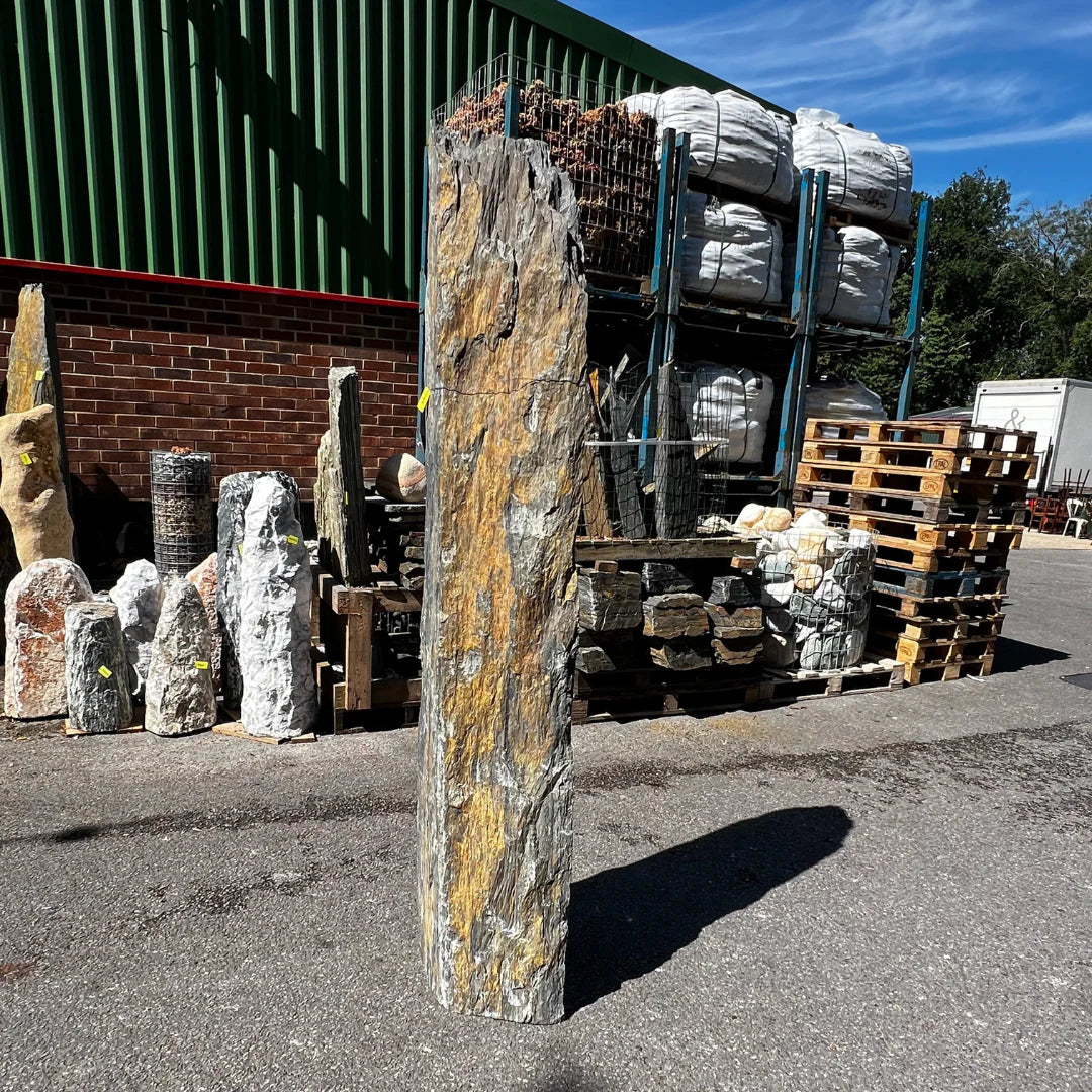 Vertical natural stone landscape feature crafted for UK gardens, combining height, texture, and natural elegance.