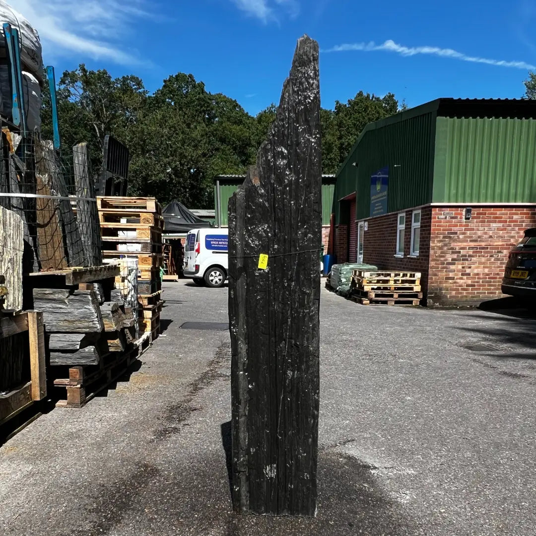 wet natural stone garden monolith with deep grey tones, enhancing modern UK outdoor spaces.